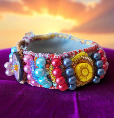 Handmade Sun and Fruits textile bracelet from the Road Talismans collection, hand-stitched with colorful beads and bright summer tones